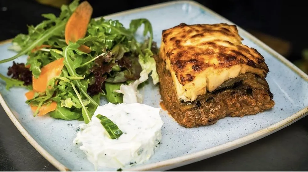 Moussaka with salad and tzatziki